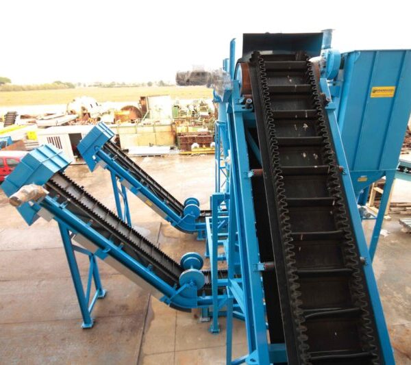 Ghirarduzzi's blue stepped conveyor, used for heavy industrial operations