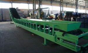 Ghirarduzzi's green curved conveyor, designed for complex industrial applications