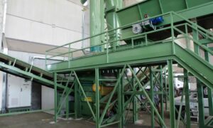 DM50 densimetric separator by Ghirarduzzi Srl integrated into a complete industrial system for separating materials like metals, plastics, and compost.