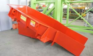 Vibrating feeder by Ghirarduzzi Srl, painted in red, designed for material feeding and dosing applications, ensuring precision and efficiency in industrial processes.